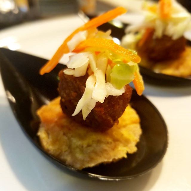 Tostones with fried pork and a spicy coleslaw